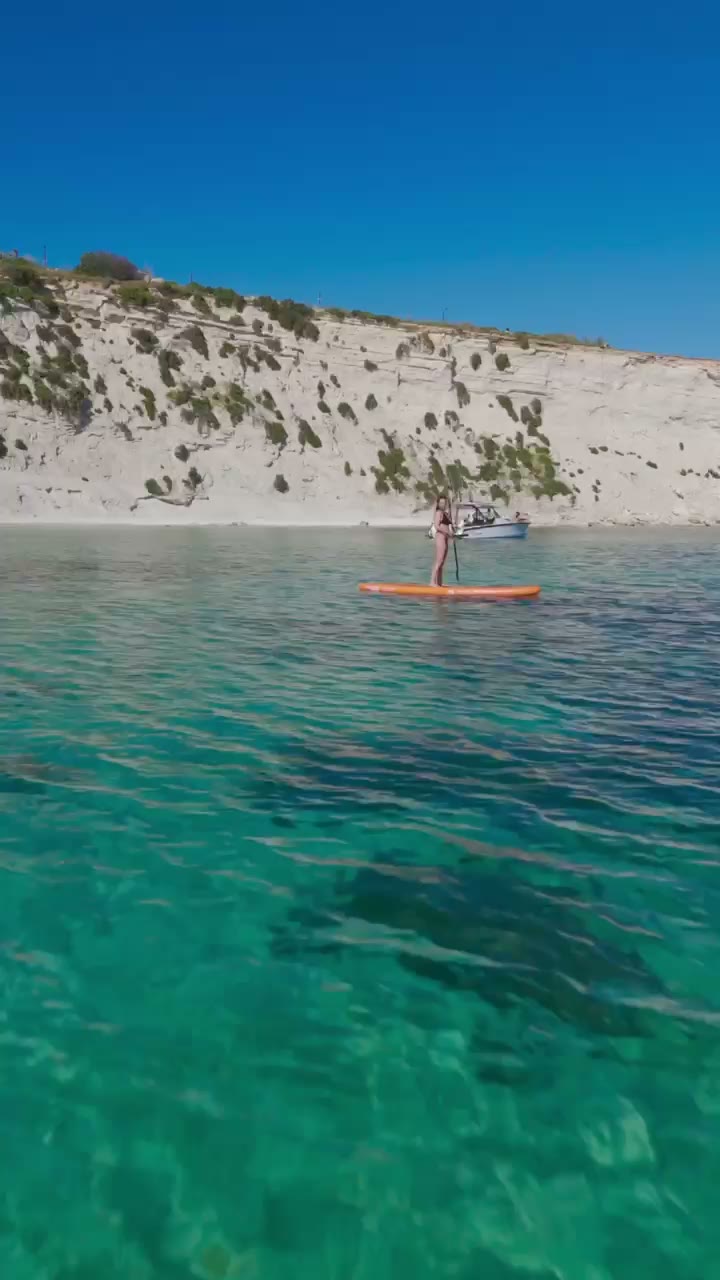 The Axopar at anchor in a turquoise bay